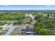 Residential neighborhood with tree-lined streets, well-maintained homes, and lush landscaping at 1202 Anderson St, Deltona, FL 32725