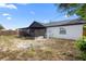 Backyard view featuring a screened patio and a fenced yard providing privacy and outdoor enjoyment at 1202 Anderson St, Deltona, FL 32725