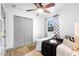 Well-lit bedroom with a ceiling fan, a closet, and a window providing natural light and ventilation at 1202 Anderson St, Deltona, FL 32725