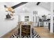 Elegant dining area with modern decor, stainless steel appliances, and vaulted ceilings at 1202 Anderson St, Deltona, FL 32725