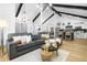 Open living room featuring vaulted ceilings, modern furnishings, and seamless access to kitchen at 1202 Anderson St, Deltona, FL 32725