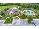 Aerial view of clubhouse, community pool, green spaces, and parking at this attractive property at 1219 Victoria Hills N Dr, Deland, FL 32724
