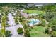 An aerial view showing community amenities including the pool, green spaces, clubhouse, and parking area at 1219 Victoria Hills N Dr, Deland, FL 32724