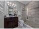 Modern bathroom featuring a glass shower, granite countertops, and vanity with a dark wood finish at 1219 Victoria Hills N Dr, Deland, FL 32724