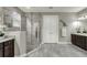 This bathroom features a glass enclosed shower, dual sink vanity, and a decorative butterfly accent at 1219 Victoria Hills N Dr, Deland, FL 32724