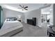Bright bedroom with a cozy bed, ceiling fan, and an adjacent sitting area for relaxed living at 1219 Victoria Hills N Dr, Deland, FL 32724