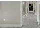 Hallway leading to bathroom with a large shower and closet with organizers at 1219 Victoria Hills N Dr, Deland, FL 32724