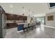 Open concept kitchen showcasing stainless steel appliances, a central island, and a dining area at 1219 Victoria Hills N Dr, Deland, FL 32724