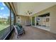 Spacious screened lanai with brick flooring, offering serene views and an ideal spot for relaxation at 1219 Victoria Hills N Dr, Deland, FL 32724