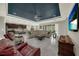 Open floor plan living room with tile floors, comfortable seating, and a view of the kitchen at 1219 Victoria Hills N Dr, Deland, FL 32724