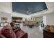 Spacious living room with tray ceiling, tile floors, and an open layout to the kitchen area at 1219 Victoria Hills N Dr, Deland, FL 32724