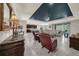 Open living space with tray ceiling, tile floors, and seamless flow to the kitchen at 1219 Victoria Hills N Dr, Deland, FL 32724
