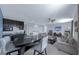 Open-concept living area with cozy seating, wet bar, and adjacent dining space for seamless entertaining at 1219 Victoria Hills N Dr, Deland, FL 32724
