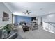 Spacious living room with comfortable seating, a ceiling fan, and natural light from the window at 1219 Victoria Hills N Dr, Deland, FL 32724