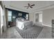 The main bedroom features a decorative accent wall, ceiling fan and an ensuite bathroom at 1219 Victoria Hills N Dr, Deland, FL 32724