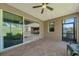 Covered patio boasts brick pavers, ceiling fan, and sliding glass doors to seamlessly blend indoor/outdoor living at 1219 Victoria Hills N Dr, Deland, FL 32724