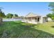 Fenced in backyard with a view of a screened-in porch at 1222 Madelena Ave, Winter Springs, FL 32708