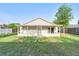 View of backyard with a screened-in porch at 1222 Madelena Ave, Winter Springs, FL 32708