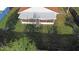 Wide backyard with a lawn and a screened-in porch at 1222 Madelena Ave, Winter Springs, FL 32708