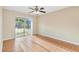 Bright bedroom with sliding glass doors leading to a screened patio and backyard at 1222 Madelena Ave, Winter Springs, FL 32708