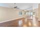 Spacious dining room with hardwood floors, large mirror, and glass sliding door at 1222 Madelena Ave, Winter Springs, FL 32708