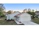 Inviting single-story home boasts a two-car garage and manicured landscaping at 1222 Madelena Ave, Winter Springs, FL 32708