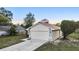 Lovely single-story house boasting a two-car garage, enhanced by mature trees and a beautifully maintained yard at 1222 Madelena Ave, Winter Springs, FL 32708