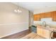 Well-lit kitchen featuring wood cabinets and stainless steel appliances at 1222 Madelena Ave, Winter Springs, FL 32708