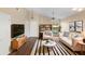 Bright living room features stylish furniture, a ceiling fan, and large windows at 1222 Madelena Ave, Winter Springs, FL 32708