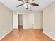 Bright main bedroom featuring hardwood floors and ensuite bathroom at 1222 Madelena Ave, Winter Springs, FL 32708