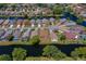 Panoramic aerial view of neighborhood featuring waterfront homes, cul-de-sacs and serene landscapes at 133 Wood Ibis Ct, Daytona Beach, FL 32119