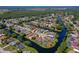 Bird's-eye view showcasing a community of waterfront homes with well-manicured lawns at 133 Wood Ibis Ct, Daytona Beach, FL 32119