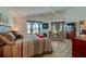 Comfortable main bedroom featuring vaulted ceiling, ceiling fan, ensuite bath and natural light at 133 Wood Ibis Ct, Daytona Beach, FL 32119