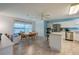 Well-equipped kitchen with stainless steel appliances, an island with seating, and tile flooring at 133 Wood Ibis Ct, Daytona Beach, FL 32119