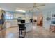 Bright kitchen featuring white cabinetry, stainless steel appliances, and a central island with seating at 133 Wood Ibis Ct, Daytona Beach, FL 32119