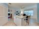 Modern kitchen featuring stainless steel appliances, a breakfast bar, and tile flooring at 133 Wood Ibis Ct, Daytona Beach, FL 32119