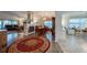Open-concept living space with fireplace, dining area, and plenty of natural light at 133 Wood Ibis Ct, Daytona Beach, FL 32119