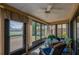 Relaxing sunroom with comfortable seating and view of the landscaped backyard at 133 Wood Ibis Ct, Daytona Beach, FL 32119