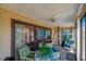Cozy sunroom with comfortable seating and sliding glass doors leading to the outdoors at 133 Wood Ibis Ct, Daytona Beach, FL 32119