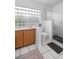 This bathroom has a glass block window, and a stand up shower with a glass door at 150 Lake Charles Rd, Deland, FL 32724