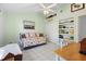 Bedroom with a pull-out couch, a built in bookshelf, and a desk for studying or working from home at 150 Lake Charles Rd, Deland, FL 32724