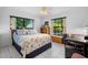 Comfortable bedroom featuring a large window and an abundance of natural light at 150 Lake Charles Rd, Deland, FL 32724