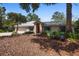 Charming single-story brick home with a well-manicured lawn and inviting entryway, and a two car garage at 150 Lake Charles Rd, Deland, FL 32724