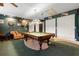A recreation room with a pool table, room for seating and lots of storage, ideal for fun and games at 150 Lake Charles Rd, Deland, FL 32724