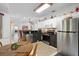 Open kitchen with stainless steel appliances, granite countertops, and a view into the living room and breakfast nook at 150 Lake Charles Rd, Deland, FL 32724