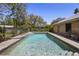 A refreshing swimming pool surrounded by lush greenery and a paved patio area, ideal for relaxation at 150 Lake Charles Rd, Deland, FL 32724