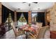 A spacious sunroom with neutral tile, curtains, and lots of natural light from the many windows at 150 Lake Charles Rd, Deland, FL 32724