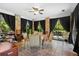 Enclosed sunroom, lots of natural light, room for seating, ideal spot for entertaining or relaxing at 150 Lake Charles Rd, Deland, FL 32724