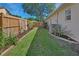 Fenced backyard featuring a well-maintained lawn, garden beds, and a peaceful outdoor space at 1504 Ginger Snap, Deland, FL 32720
