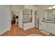 A well lit bathroom with a glass shower, double vanity, and direct access to the main bedroom at 1504 Ginger Snap, Deland, FL 32720